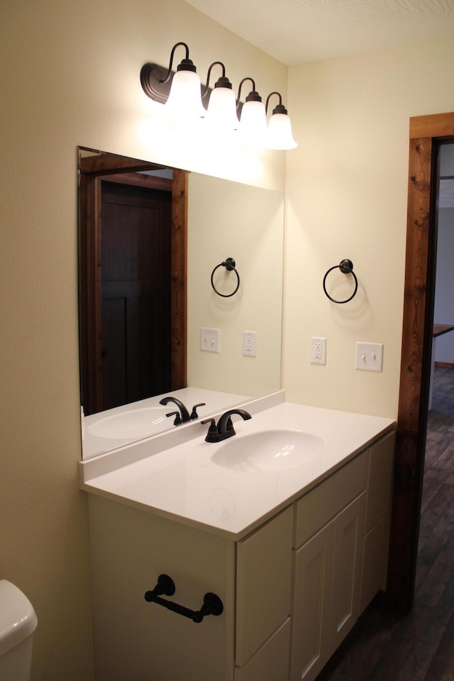 410 Park St, Taneyville, MO 65759 - half bath featuring vanity, wood finished floors, and toilet