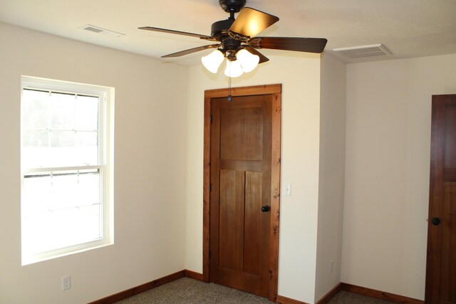 410 Park St, Taneyville, MO 65759 - empty room with healthy amount of natural light, baseboards, and a ceiling fan