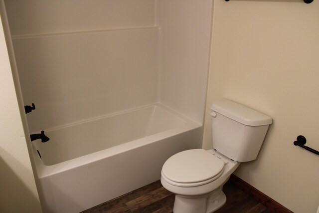 410 Park St, Taneyville, MO 65759 - bathroom featuring wood finished floors and toilet