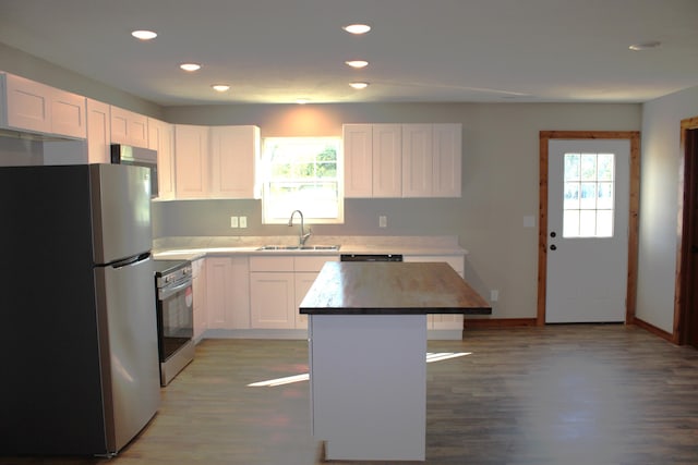 410 Park St, Taneyville, MO 65759 - kitchen with stainless steel appliances, a sink, white cabinetry, recessed lighting, and light wood-style flooring