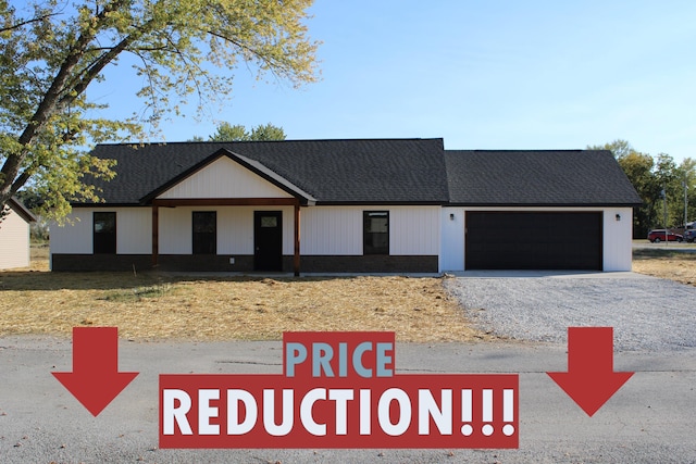410 Park St, Taneyville, MO 65759 - modern farmhouse style home with a garage and asphalt driveway