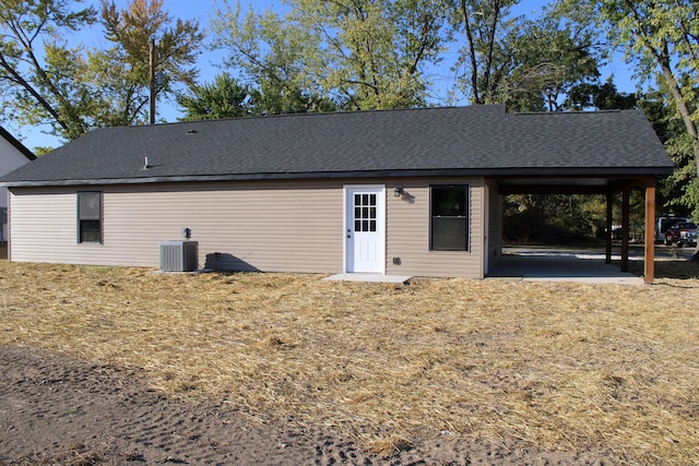 430 Park St, Taneyville, MO 65759 - rear view of house with central AC and roof with shingles