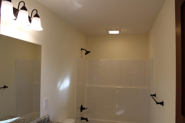 430 Park St, Taneyville, MO 65759 - bathroom featuring shower / tub combination and toilet