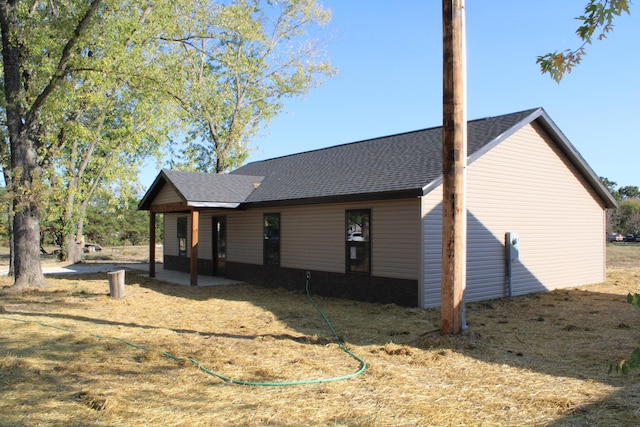 430 Park St, Taneyville, MO 65759 - rear view of property with roof with shingles and a patio area