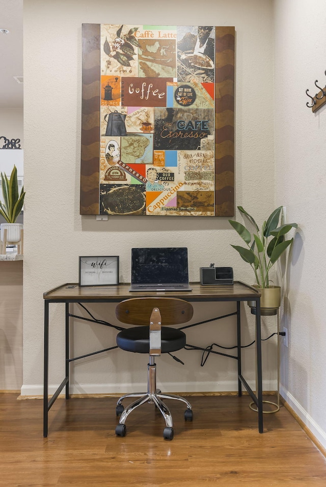 home office featuring hardwood / wood-style flooring