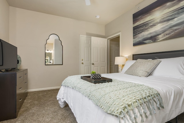 bedroom with dark carpet and ceiling fan