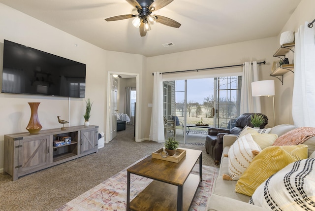 living room with ceiling fan and light carpet