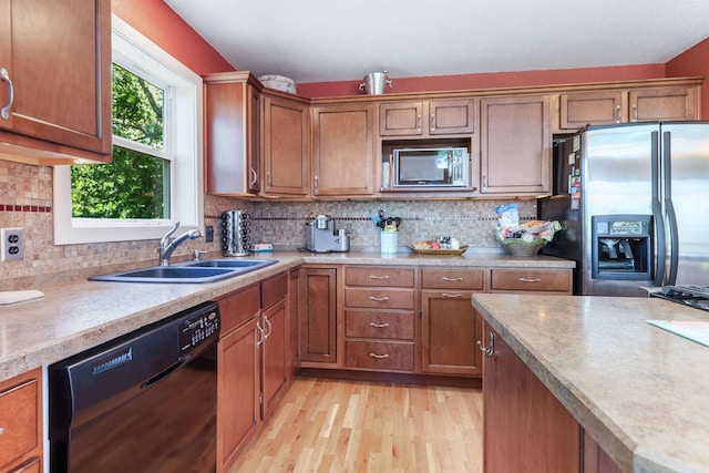 89 Turkey Trl, Blue Eye, MO 65611 - kitchen with a sink, stainless steel fridge, light wood finished floors, light countertops, and black dishwasher