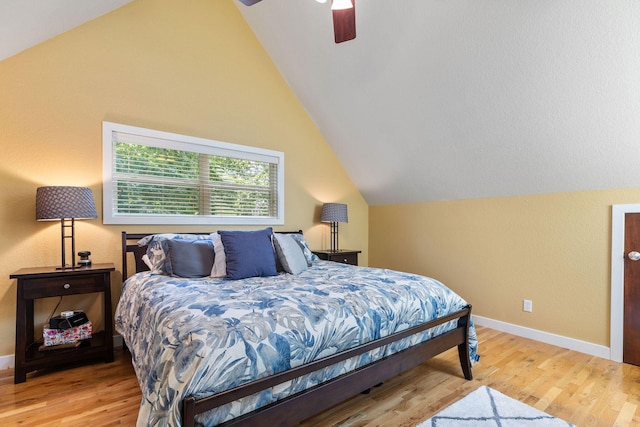 bedroom featuring ceiling fan, vaulted ceiling, and light hardwood / wood-style flooring