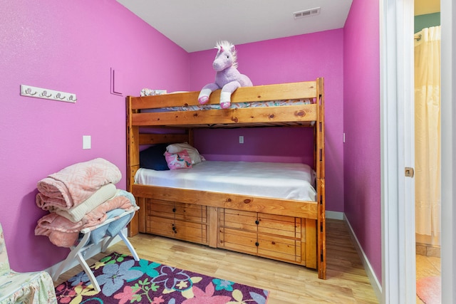 bedroom with light hardwood / wood-style flooring