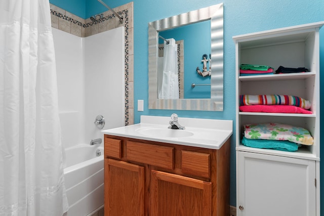 bathroom with shower / bath combination with curtain and vanity