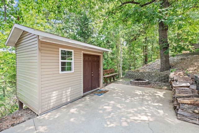 89 Turkey Trl, Blue Eye, MO 65611 - view of outbuilding featuring an outdoor structure and an outdoor fire pit