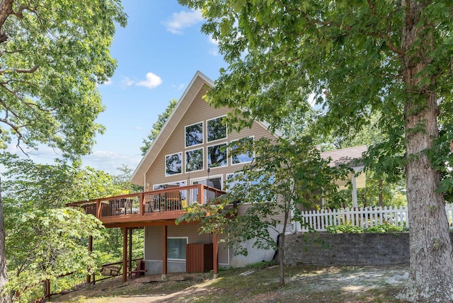 89 Turkey Trl, Blue Eye, MO 65611 - back of property with fence and a deck