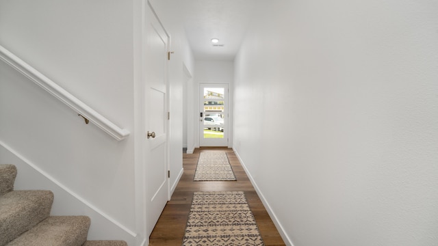 hall with dark hardwood / wood-style floors