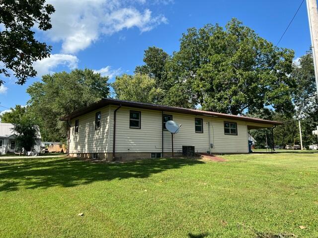 106 Martin St, Licking, MO 65542 - rear view of property with a lawn and cooling unit