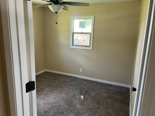 106 Martin St, Licking, MO 65542 - carpeted empty room featuring baseboards and ceiling fan