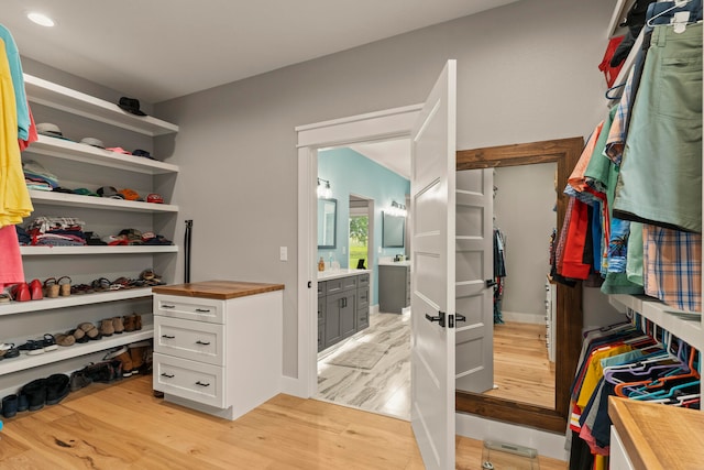 walk in closet featuring light hardwood / wood-style floors