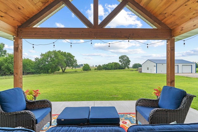 view of patio featuring an outbuilding and a garage