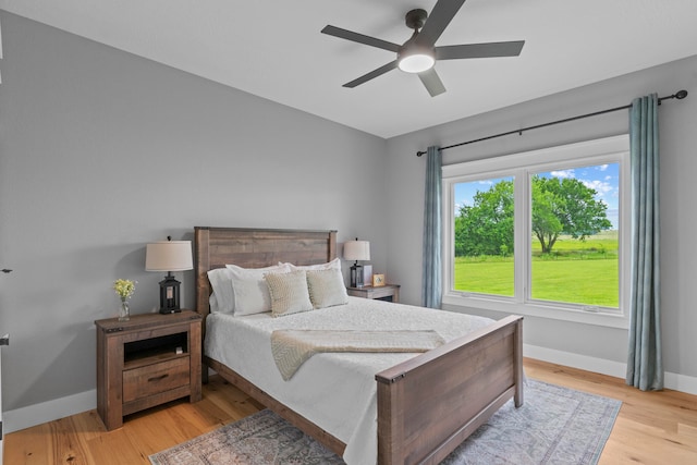 bedroom featuring ceiling fan and light wood-type flooring