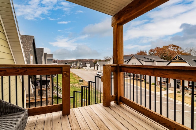 wooden terrace featuring a residential view