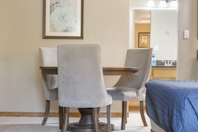 view of carpeted dining space