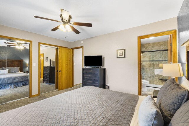 carpeted bedroom with connected bathroom, ceiling fan, and multiple closets