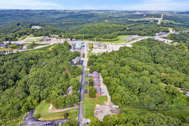 aerial view featuring a wooded view