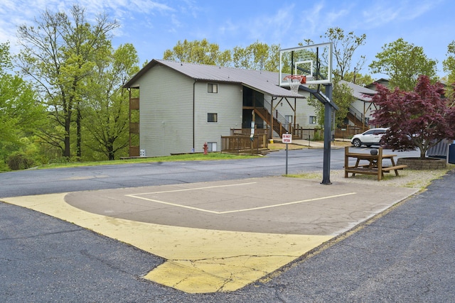 view of sport court featuring basketball hoop