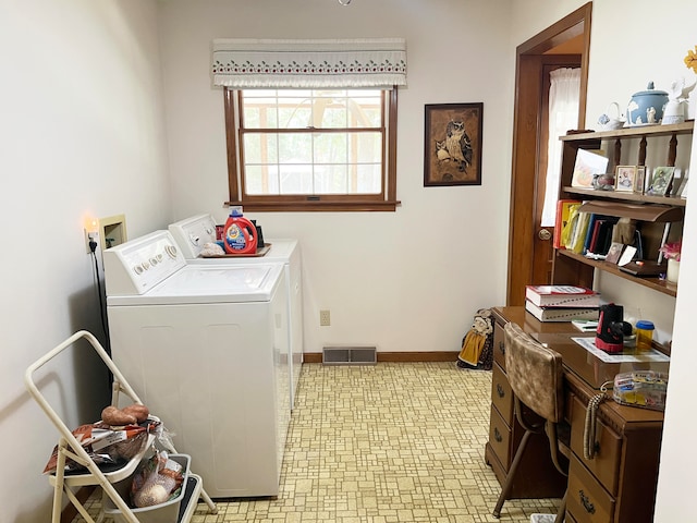 clothes washing area with washer and dryer