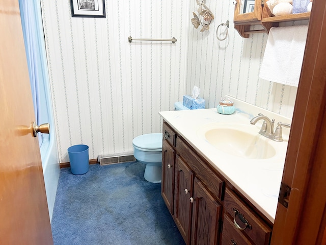 bathroom with toilet and vanity