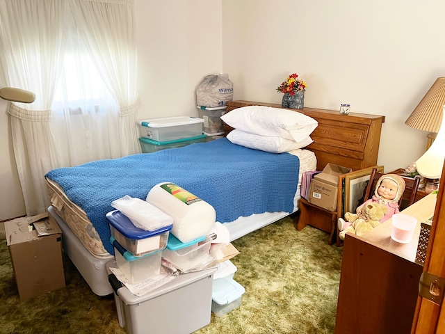 bedroom featuring dark colored carpet