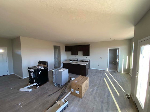 kitchen featuring hardwood / wood-style floors and a kitchen island