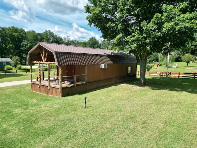 view of side of property with a yard