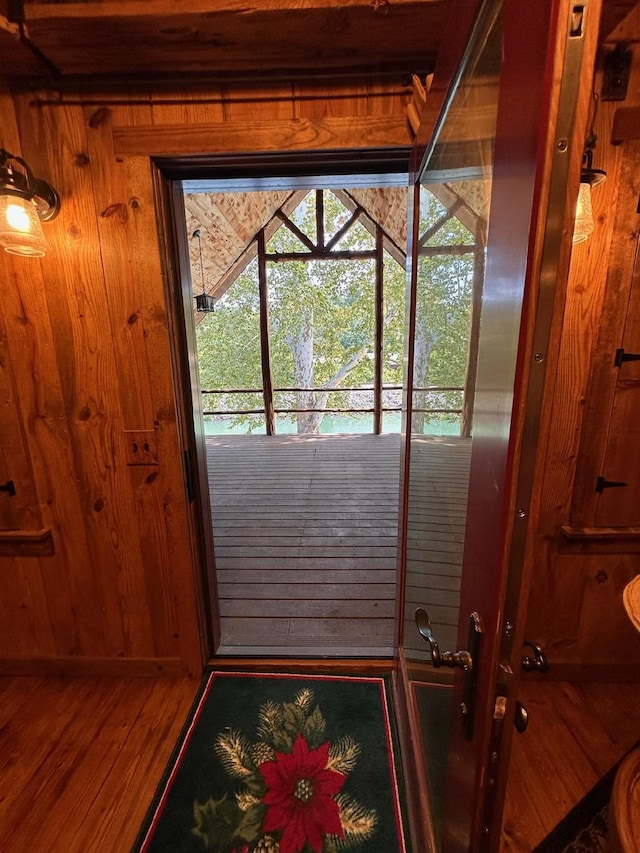 entryway featuring wooden walls