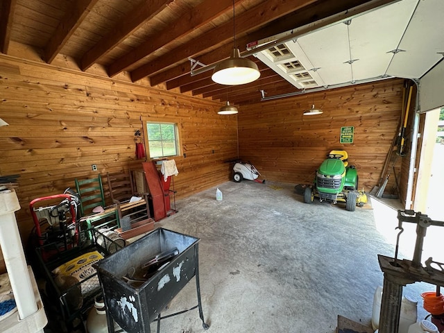 interior space with wood walls and concrete floors