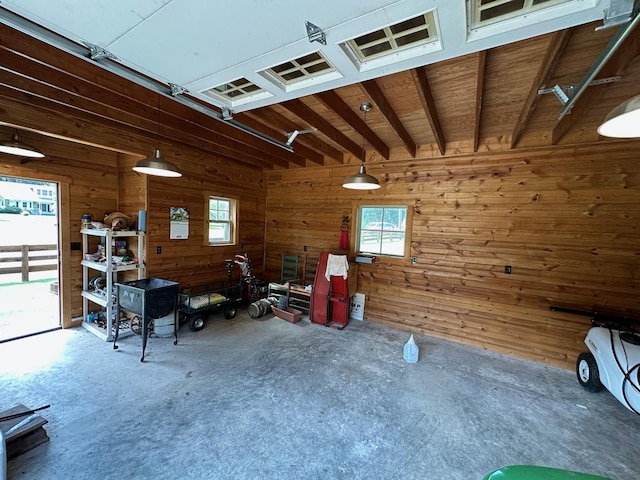 garage featuring wooden walls