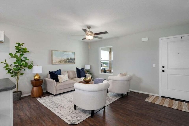 living room featuring dark hardwood / wood-style flooring and ceiling fan