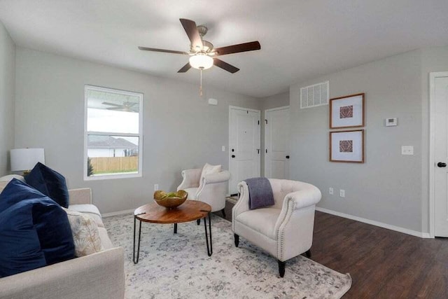 sitting room with ceiling fan and hardwood / wood-style flooring