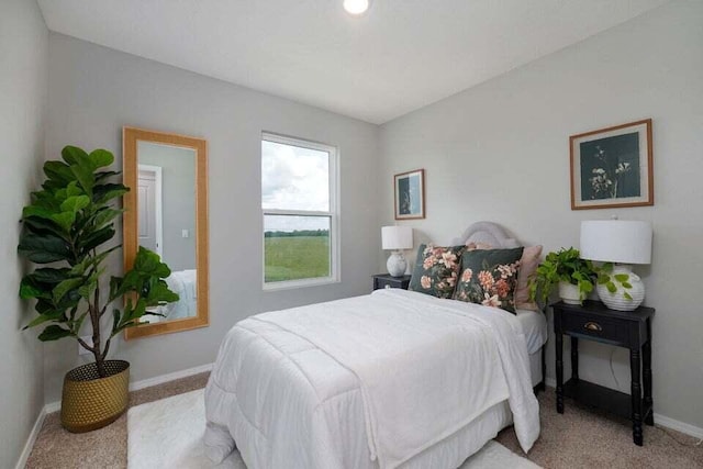 bedroom featuring light carpet