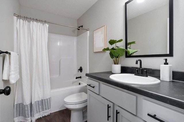 full bathroom with wood-type flooring, toilet, vanity, and shower / bathtub combination with curtain