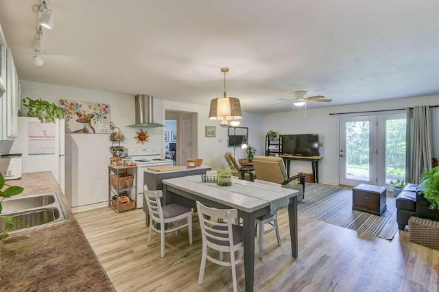 22016 Waters Edge Dr Unit 1A, 2B, 3C, Shell Knob, MO 65747 - dining room with light wood-style floors, rail lighting, a ceiling fan, and baseboards