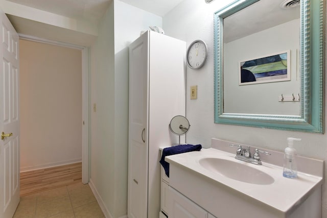 bathroom with vanity and tile patterned flooring