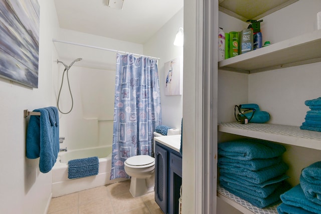 full bathroom with vanity, shower / tub combo, toilet, and tile patterned floors