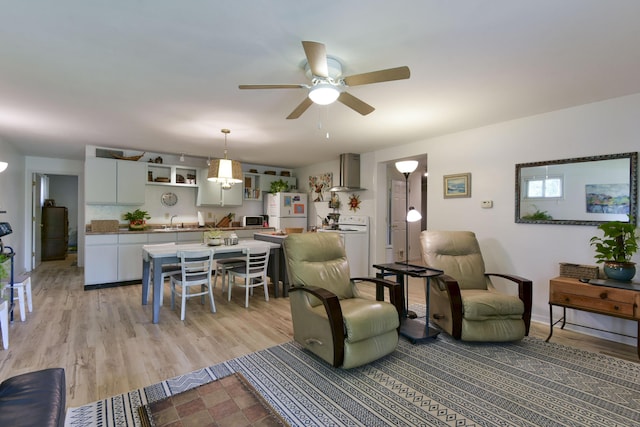 22016 Waters Edge Dr Unit 1A, 2B, 3C, Shell Knob, MO 65747 - living room featuring washer / dryer, light wood-type flooring, and ceiling fan