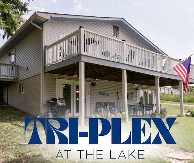 22016 Waters Edge Dr Unit 1A, 2B, 3C, Shell Knob, MO 65747 - exterior space with a wooden deck, a lawn, and brick siding