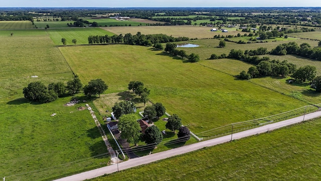 birds eye view of property featuring a rural view and a water view