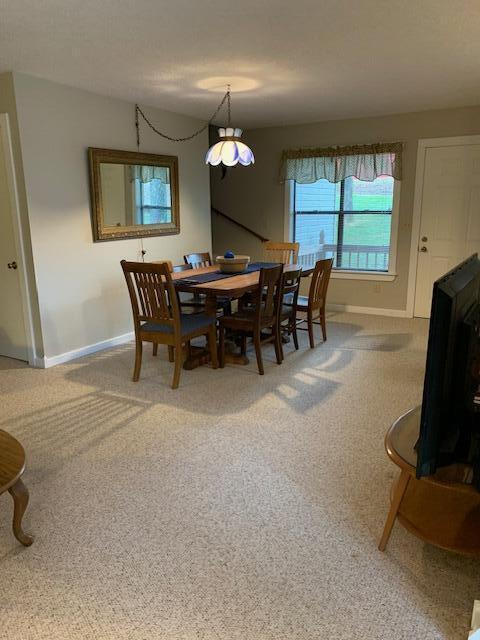 43 Dale Dr, Kimberling City, MO 65686 - carpeted dining room with baseboards