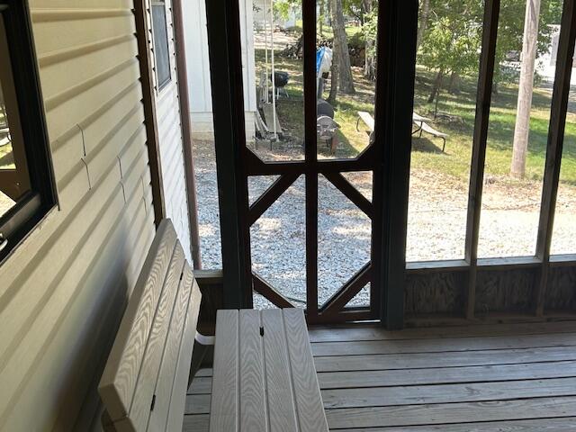 entryway with hardwood / wood-style floors