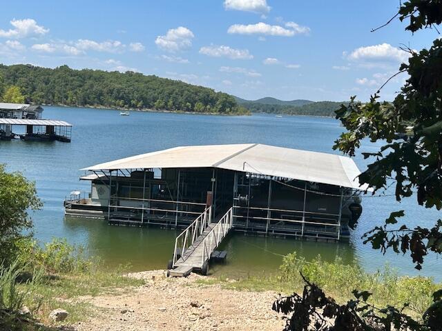 43 Dale Dr, Kimberling City, MO 65686 - view of dock featuring a forest view and a water view