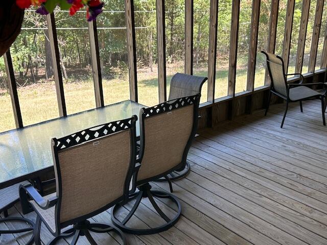 sunroom / solarium featuring plenty of natural light